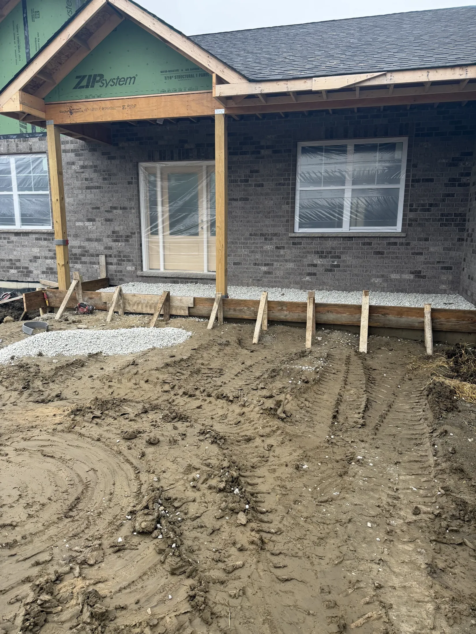 Outdoor patio with finished stone and seating area