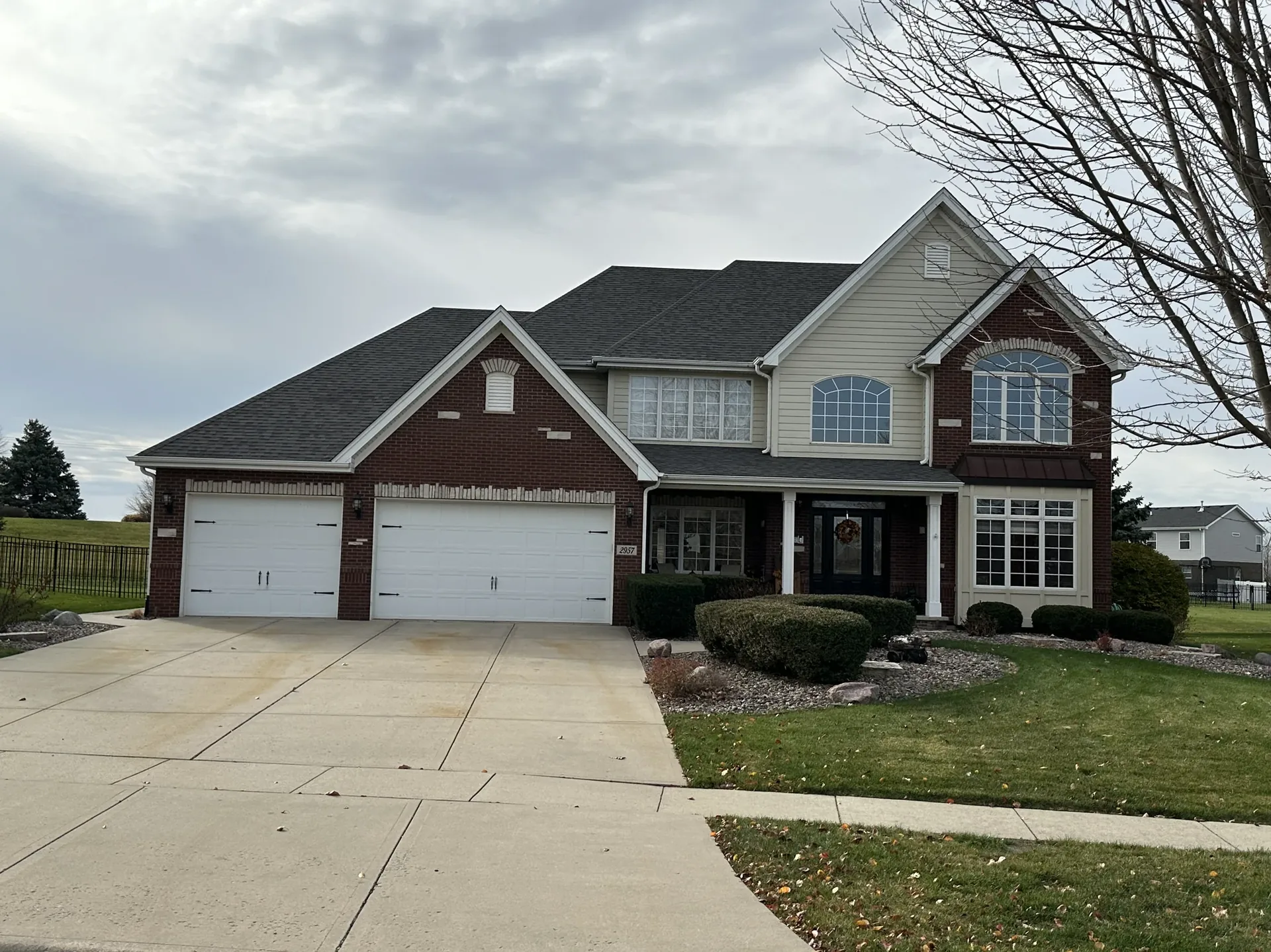 Finished two-story brick custom home with three-car garage