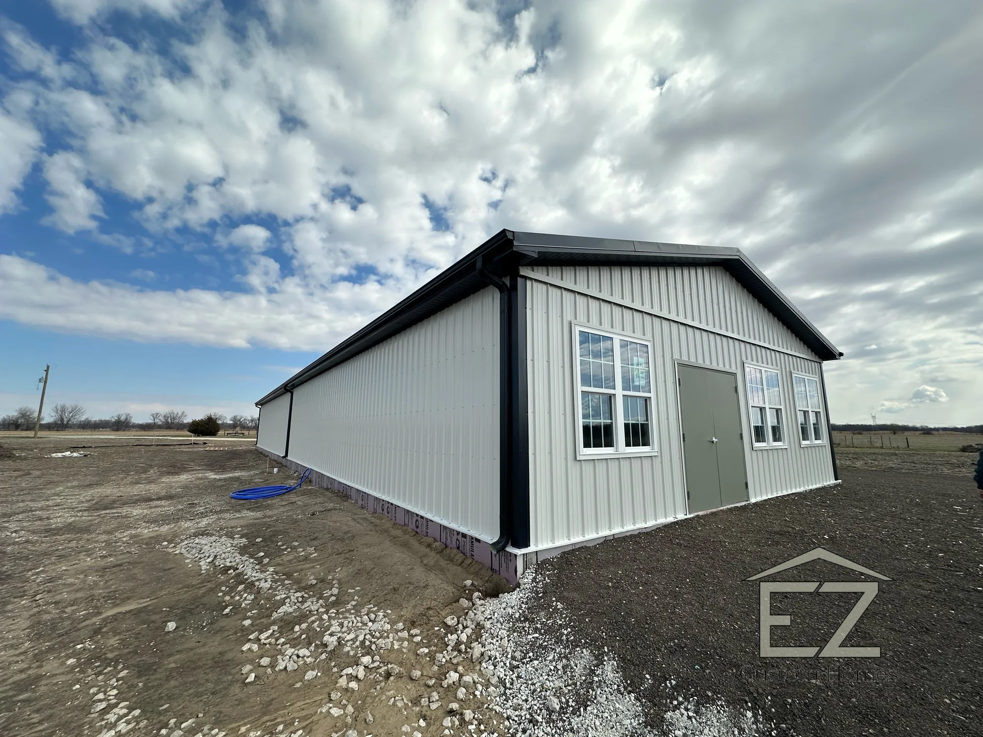 Barndominium-style post-frame custom build by EZ Custom Homes in New Lenox, IL