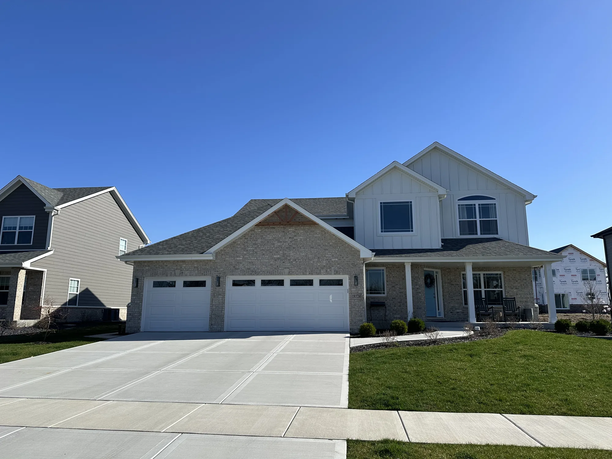 Finished two-story brick custom home with three-car garage